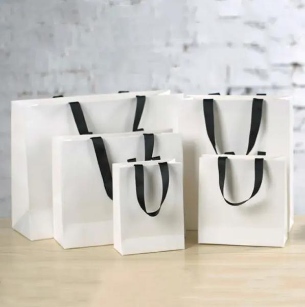 Customizable Pink Kraft Paper Bag Carton Packaging Luxury Style Custom Logo Handles Jewelry Perfumes Crafts Christmas Gifts