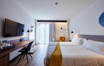 Tunisia hotel furniture manufactuer from china by Laminate wood headboard bed with long desk table and Fabric sofa chair