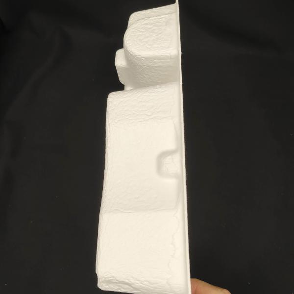 OEM manufacturers customize pulp molded packaging bases for small household appliance fascia guns. These are made of white plant fibers through dry pressing.