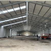 Q235 Edificio de almacenes prefabricado de estructura de acero con panel de pared de rockwool de perno de anclaje M20