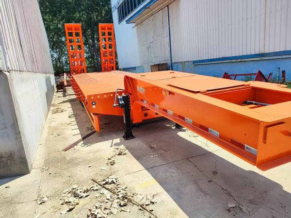 Orange 3-Axle Lowboy Semi-Trailer: 60T Payload, Sturdy Design for Heavy Loads