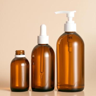 Round Amber Cosmetic Bottles for Storing and Dispensing Beauty Products Conveniently
