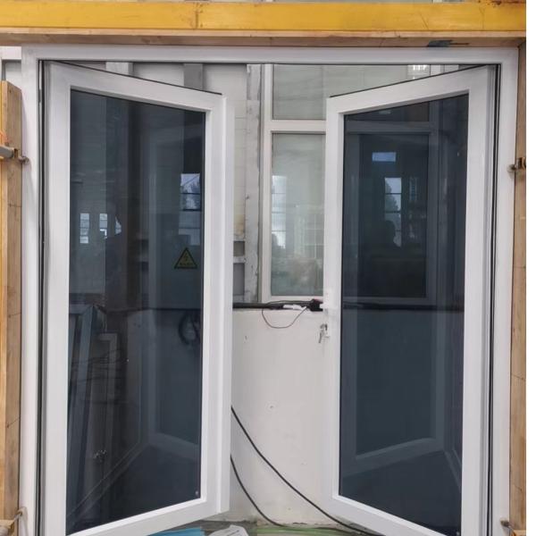 Puertas de vidrio a prueba de viento con doble bisagra PVC Puerta de vidrio resistente a impactos ODM