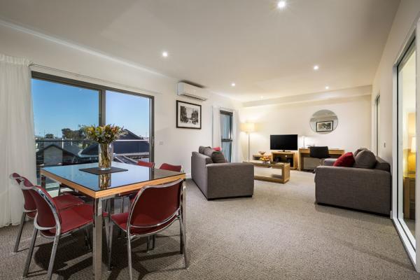 Hotel executive apartment bedroom furniture by upholstered bed and Laminate wood table with cabinet