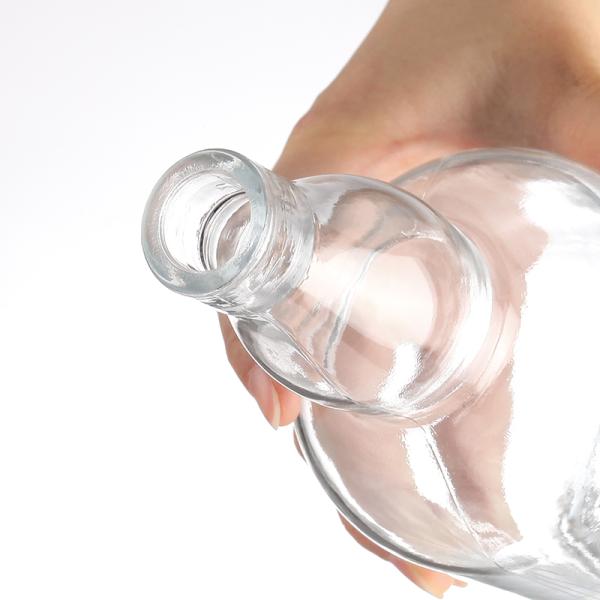 Garrafa de vidro de 750 ml de rum vodka com forma única e material de colarinho de plástico de alumínio PP