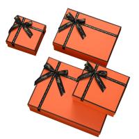 Caja de regalo de papel de lujo de empaquetado de la actual caja de la caja de la cartulina con el arco para la ropa