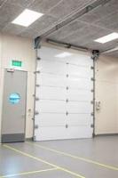 O painel seguro Waterproofing do dedo secional industrial automático da porta 40mm revestiu o aço