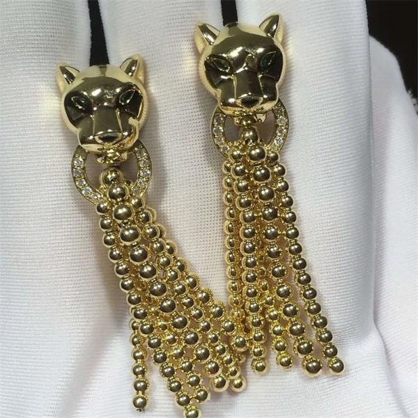 C earrings, 18K gold, inlaid with 34 round bright cut diamonds, Shafrey garnet leopard eyes, Onyx factory in China