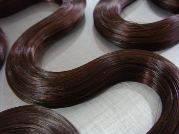 La bande ondulée dans les extensions de cheveux 5 grammes - 8 grammes