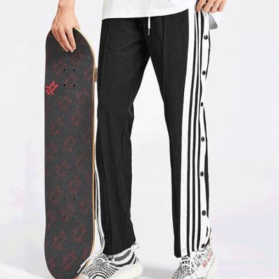 Calças de pista de skate hip hop customizadas para homens com faixa lateral e botões