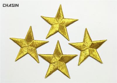 O mini bordado do vestuário remenda o ferro das estrelas do ouro na roupa das crianças