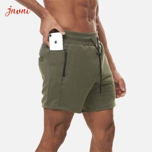 O Activewear dos homens Squatting do halterofilismo assenta o short do exercício