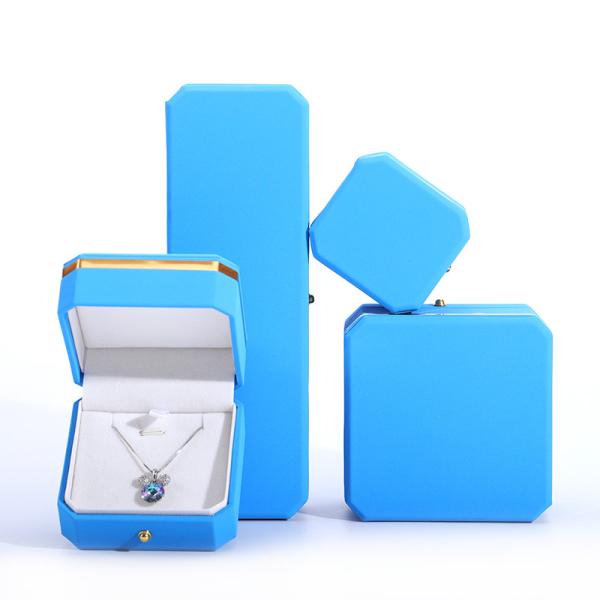 Caja de joyería de envoltura de regalo de cuero PU azul para el logotipo personalizado de botón de metal octogonal de Hanhong