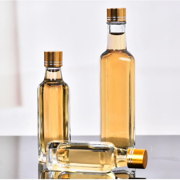 Glass Olive Oil Bottle 100ml 250ml 500ml Round Clear Cooking Oil Bottle with Cap