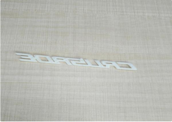 White / Ivory Automotive Plastic Injection Molding Custom Vehicle Logos Sub Gate Type