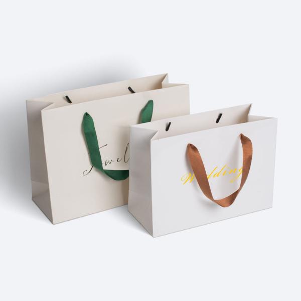 CMYK Bolsa de regalo de compras Partone para diseño personalizado 250 Gsm Art Papel de ropa embalaje