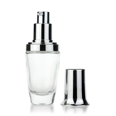 Cuidados com a pele que empacotam as garrafas de vidro cosméticas 30ml com bomba da loção
