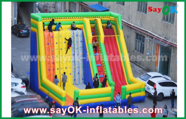 Infláveis gigantes deslizam a corrediça inflável colorida do leão-de-chácara de 9.5*7.5*6.5m com a parede de escalada para o parque de diversões