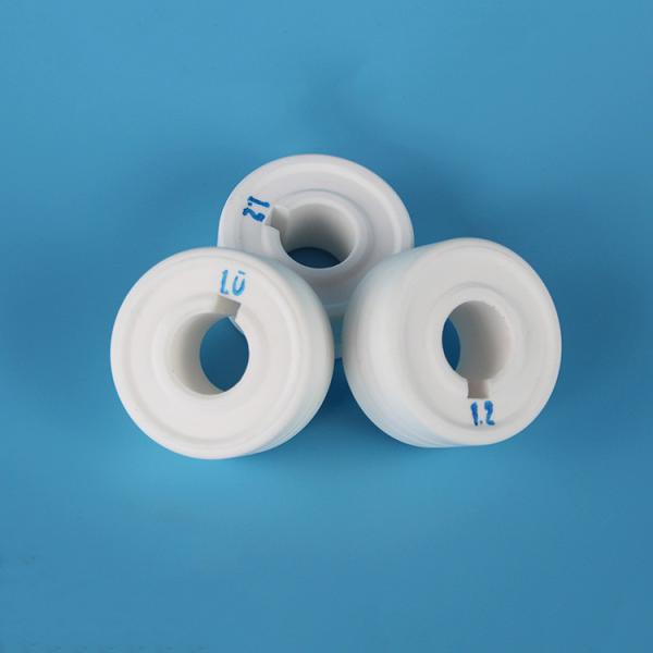 Corrosion resistant ceramics for alumina wire feeder