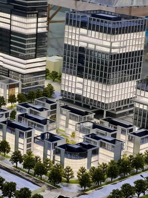 Architectural Model of Modern Urban Complex with Integrated Stadium, Business District and Landscaping