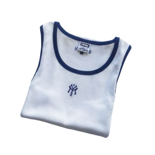 Mens tanktop featuring 100 percent cotton waffle fabric body solid color with contrast color rib piping around neck and armhole