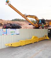 Excavatrice à bras télescopique réglable en longueur