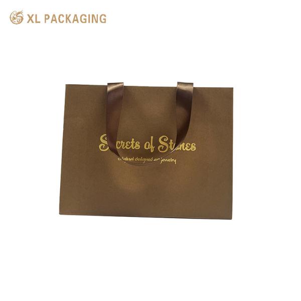 Luxury Paper Gift Bag with Gold Foil Hot Stamping, Wide Satin Ribbon Handles, and Triangular Foldable Bottom