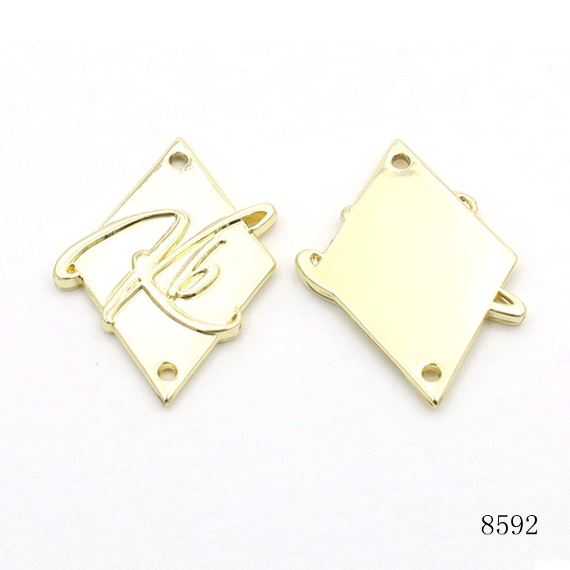 None Rusty Garment Leather Bag Design Metal Label Gold Plated Custom Metal Embossed Logo Plate with Sewing Holes