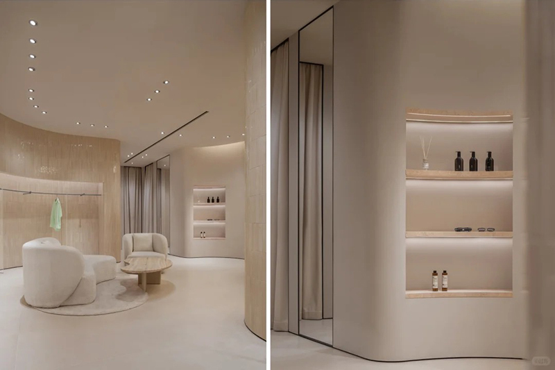 Wabi Sabi Minimalist Women Clothing Store Interior Design with Natural Travertine Curved Wall and Multi-functional Zoning Layout