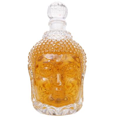 A cabeça da Buda dá forma às garrafas de vinho de vidro vazias 750ml original para a vodca/uísque com bujão