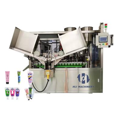 Machine de remplissage et d'étanchéité de tubes de crème pour cheveux cosmétiques