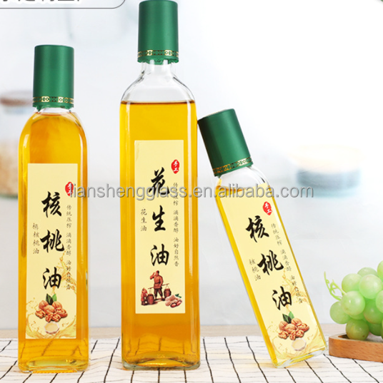 Bouteille d'huile d'olive ronde en verre vert avec couvercle Bouteille d'huile d'olive avec personnalisation du logo