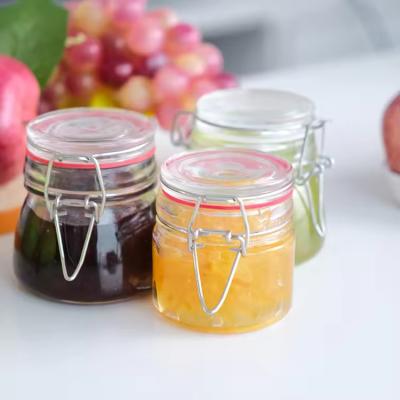 Popular Wholesale 100ml 180ml 280ml Food Grade Round Honey Glass Jar With Clip Cover