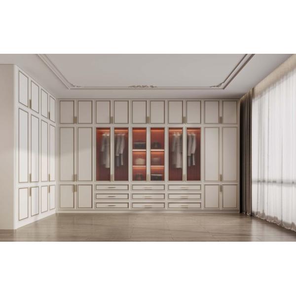 French Style Custom Walk-In Closet with Cream Doors & Gold Trim