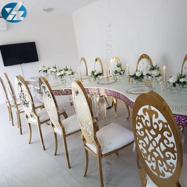 Oro de la venta directa de la fábrica que apila la silla del banquete