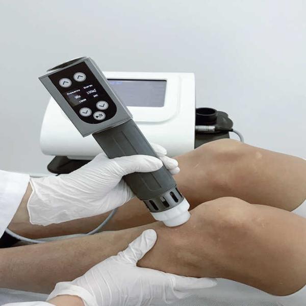 A máquina física da terapia da inquietação da massagem alivia a dor do ombro