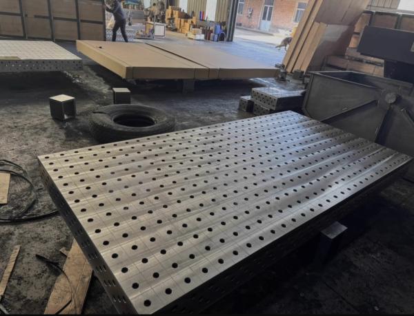 Professional modular welding table with grid hole pattern and accessories