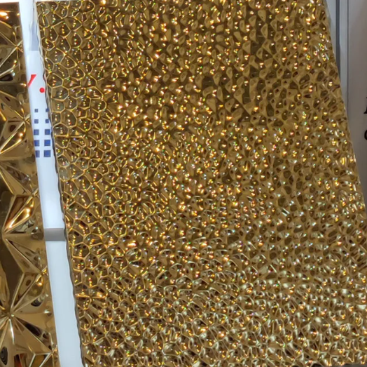 Premium 304 titanium gold water wave steel panel for luxury decoration.