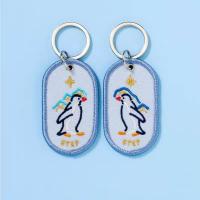 Llamadas de llave de pareja de pingüinos. Recuerdos a medida. Bordados de doble cara. Tejido de gradiente estelar.