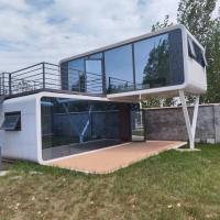 Pré-construire une Apple House à l'épreuve du vent avec une terrasse en porte de verre coulissante