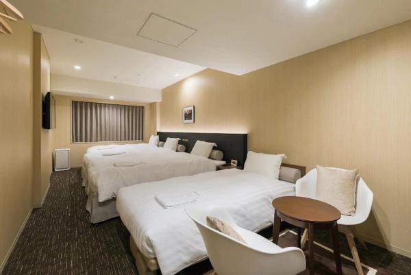Auckland hotel inn resort Laminate wood headboard bed with in wall cabinet and TV panel stand
