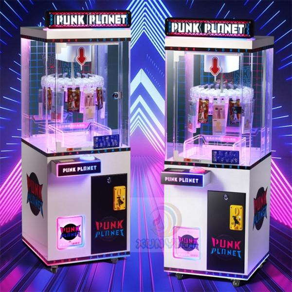 Une grue à griffes en métal acrylique plastique personnalisée vendant des jeux pour des prix passionnants