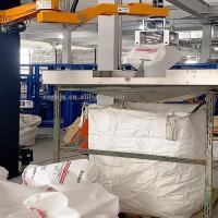 Empileur automatique de cartons, sacs, barils et bouteilles par bras robotisé pour palettes.