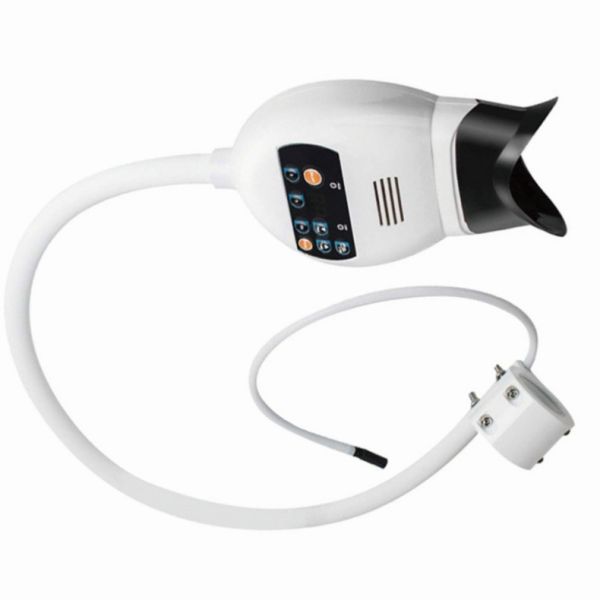 Machine de blanchiment des dents montée sur une chaise dentaire Lumière blanchissante froide lumineuse violette lumineuse