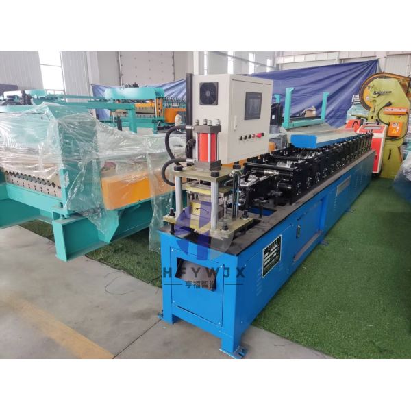 High Speed Galvanized Steel Roller Door Roll Forming Machine PLC Control System And 16mm Wall Plate