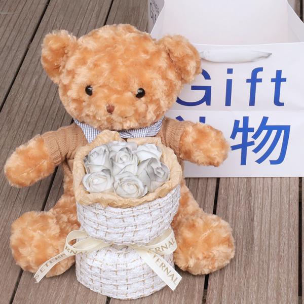 A teddy bear doll bouquet, a birthday gift for graduation on the Qixi Festival, a girl gives her best friend and girlfriend a teddy bear hug and a soap bouquet
