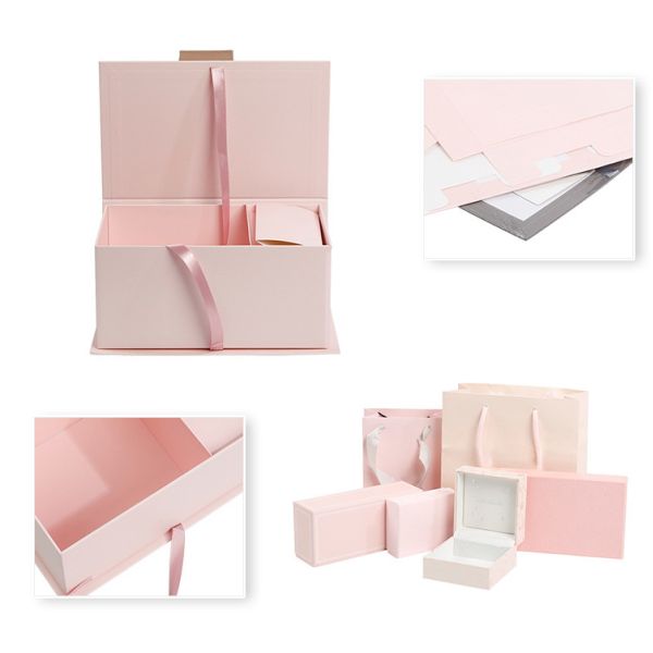 Цветки украшают дырочками коробку складного подарка упаковывая с бумажными мешками ленты