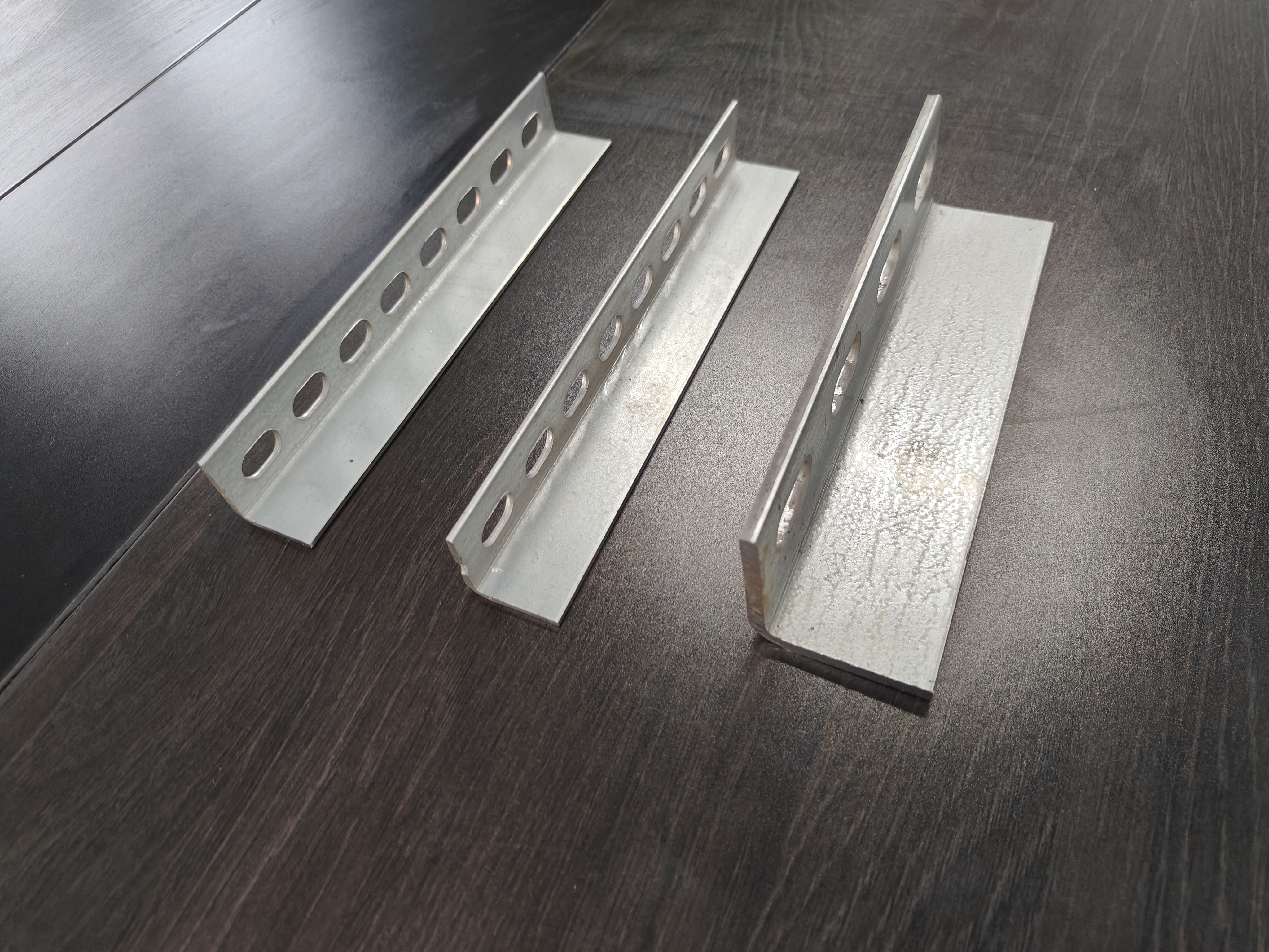 Perforated Punched Angle Iron Structural Steel Profiles with Galvanized Polished or Painted Finishes for Long Lasting Industrial