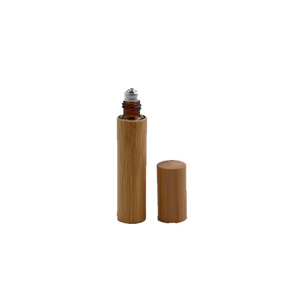 Rolo de bambu nas garrafas de perfume que gravam a superfície com bola de aço inoxidável