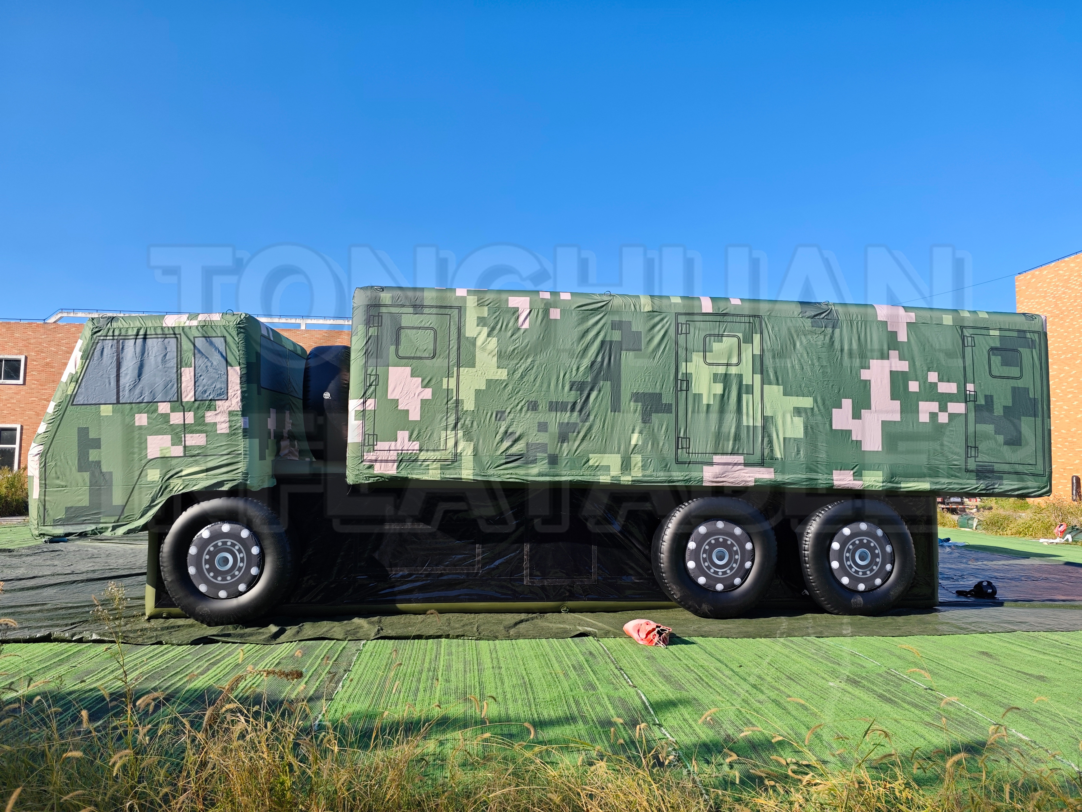 Inflatable Support Vehicle Simulation Model with Custom Size Equipment Cabin Wheel Configuration and Camouflage Artwork for Exhibitions Training Programs and Project Installations